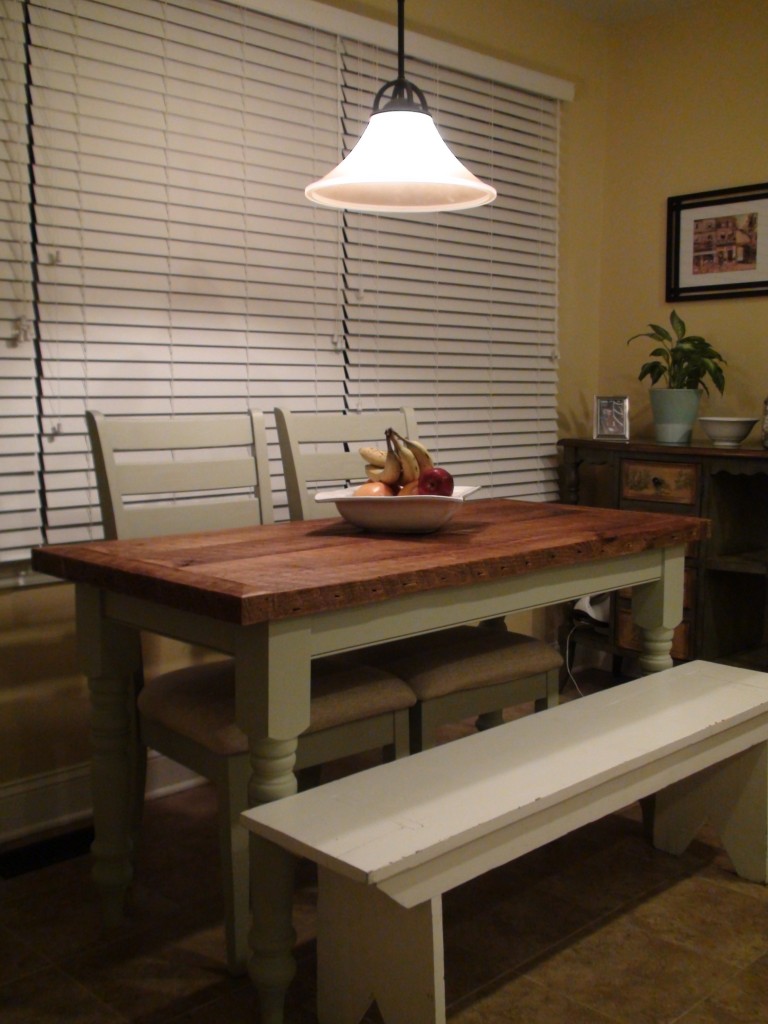farmhouse table in our last house with white antique bench