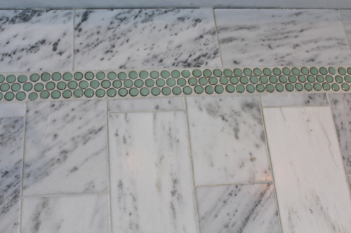 penny tile accent band grouted