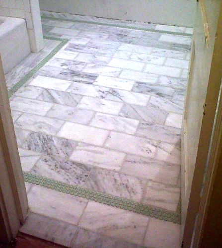 Another crummy blackberry photo, sorry! I had to use it though because as soon as Pav finished grouting he moved in the vanity. 