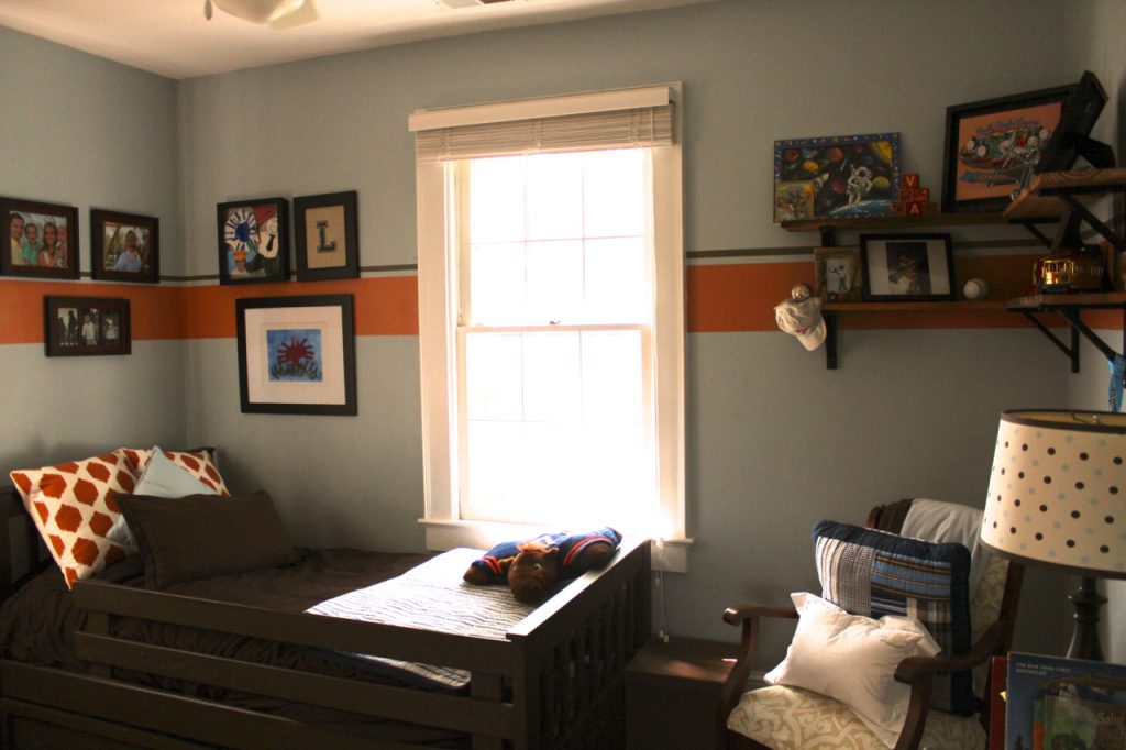 Landon's room with rustic wood and metal shelves.